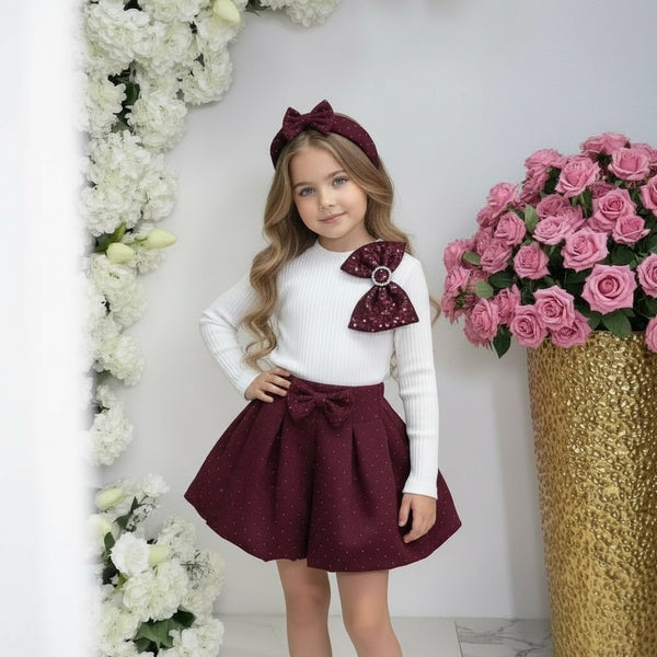 Completo 
Maglia a costine con fioccone 
Gonna brillantinata - 9611